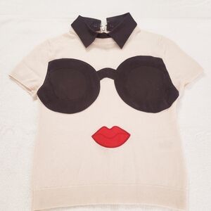 Beige Top with Black Collar and Graphic Design